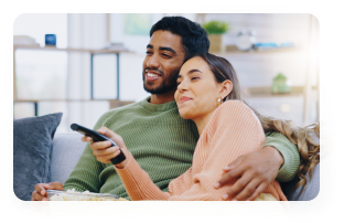 Couple watching television together