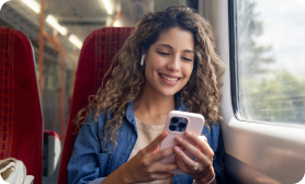 Woman on a train looking at her phone