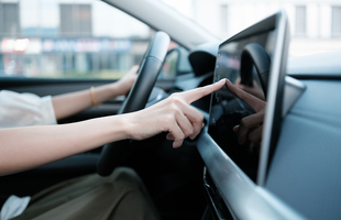 Driver using an in-car audio touchscreen